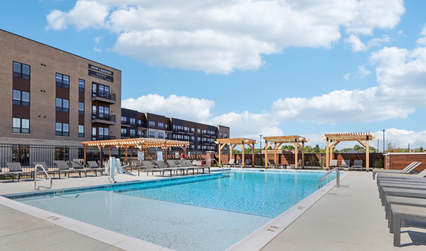 Swimming pool with sundeck and chairs