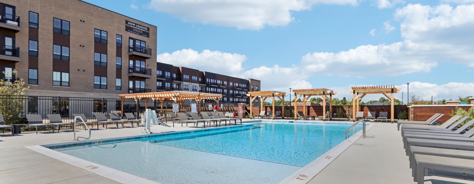 Swimming pool with sundeck and chairs