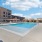 Swimming pool with sundeck and chairs